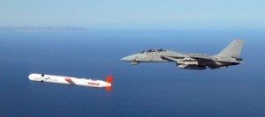 A Tactical Tomahawk Block IV cruise missile being escorted by a US Navy F-14 Tomcat fighter during a controlled test over southern California. (US Navy photo)