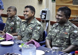  Maldivean Coast Guardsmen join officers for introductions and lunch in the wardroom of USS Momsen