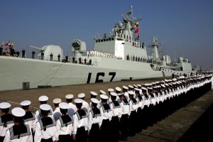 Chinese Navy soldiers attend a ceremony to see off the missile destroyer Shenzhen on a dock of Zhanjiang, southeast China