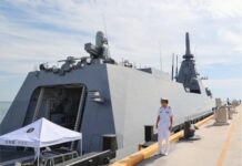 Mogami-class frigate docks in Darwin