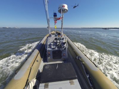 A Navy patrol boat converted to operate unmanned as part of an Office of Naval Research experiment in autonomous “swarms.” 